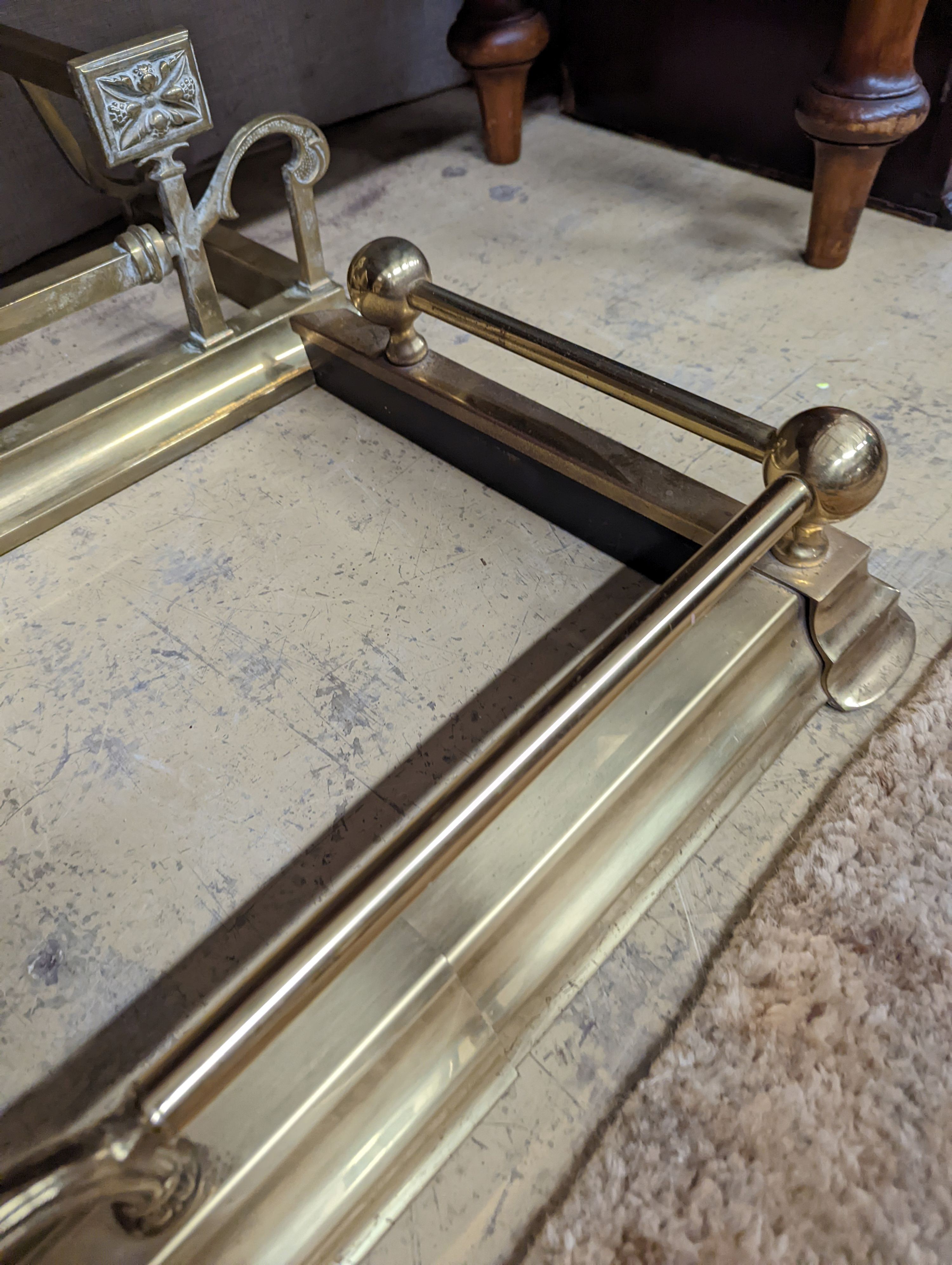 Two Edwardian and later brass fenders, one telescopic